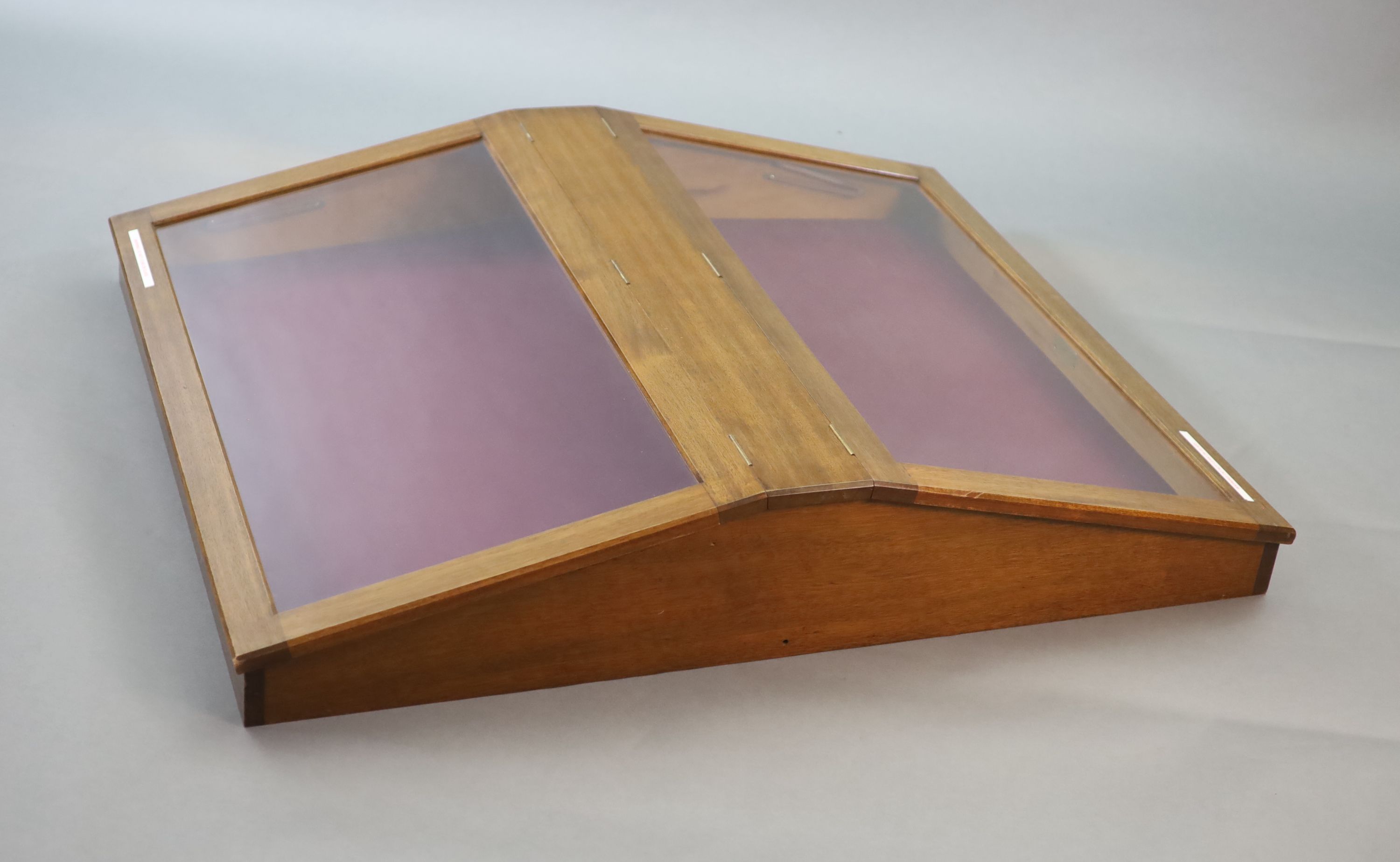 A 20th century teak table top double display case, from the Library of the Royal College of Surgeons, length 125cm width 102cm height 23cm